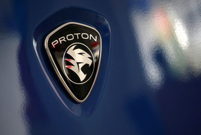 A Proton logo on a car at a Proton showroom in Puchong